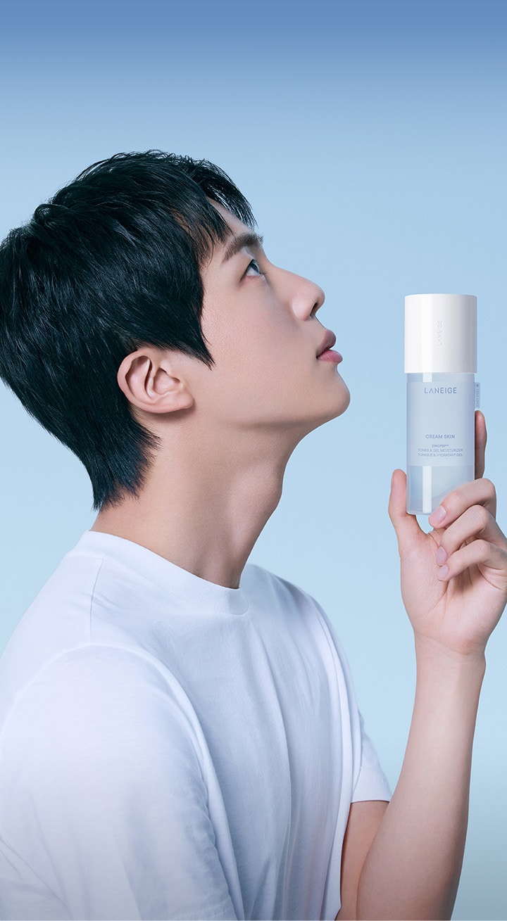 BTS member Jin holding CREAM SKIN ZINCPEP™ TONER & GEL MOISTURIZER product